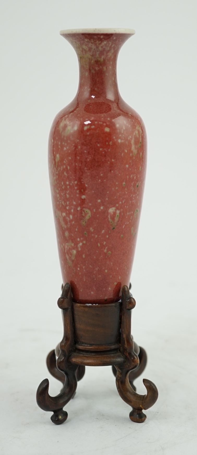 A small Chinese peach bloom glazed vase with fitted wood stand, Republic period